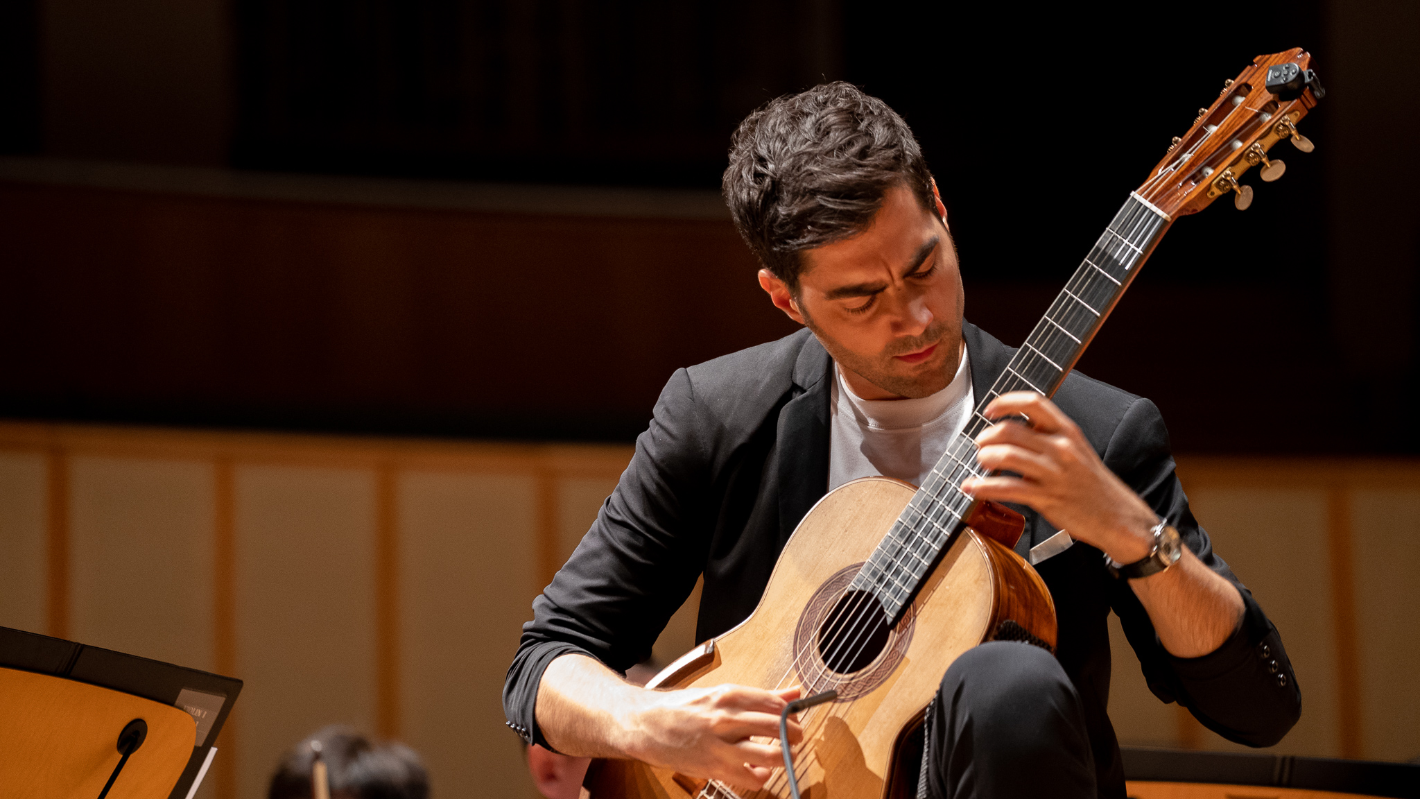 Miloš Karadaglić performing classical guitar during the 2024 North American tour